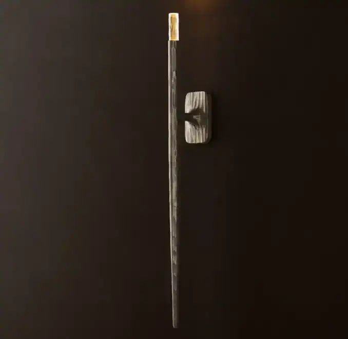 Modern wall sconce with brass accent for elegant lighting.