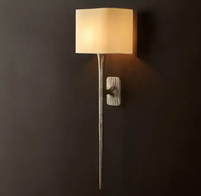 Modern metal sconce wall light with beige shade for elegant decor.