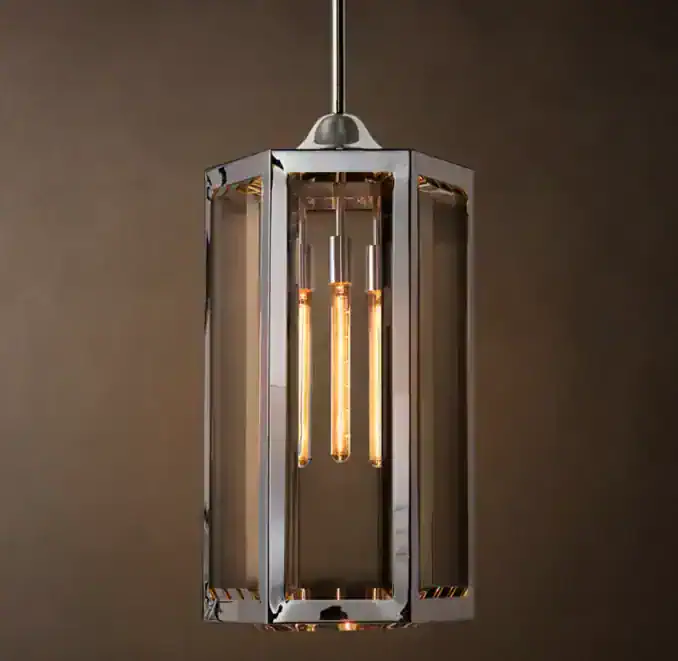 Modern glass and brass pendant light for stylish interior decor.