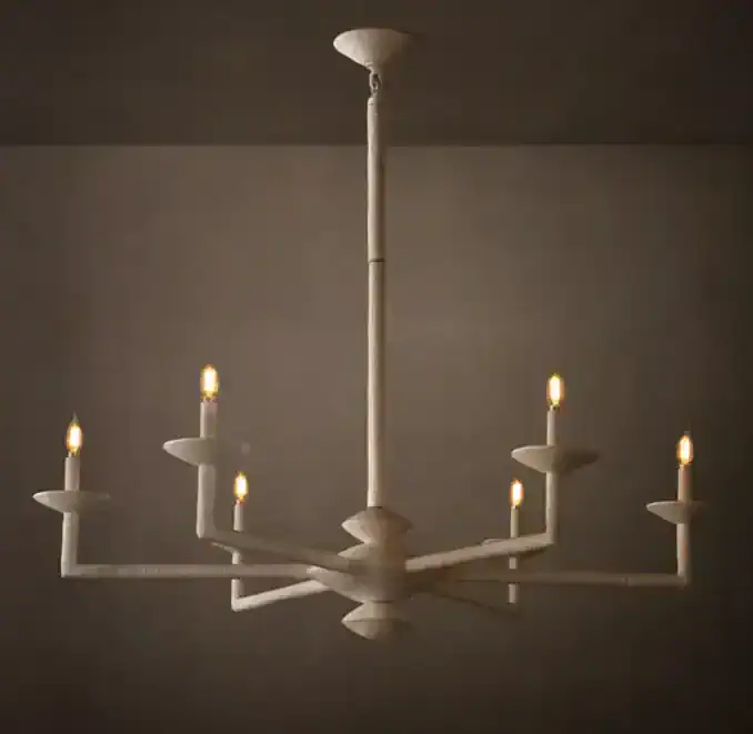 Modern white chandelier with multiple candle-style lights for elegant lighting.