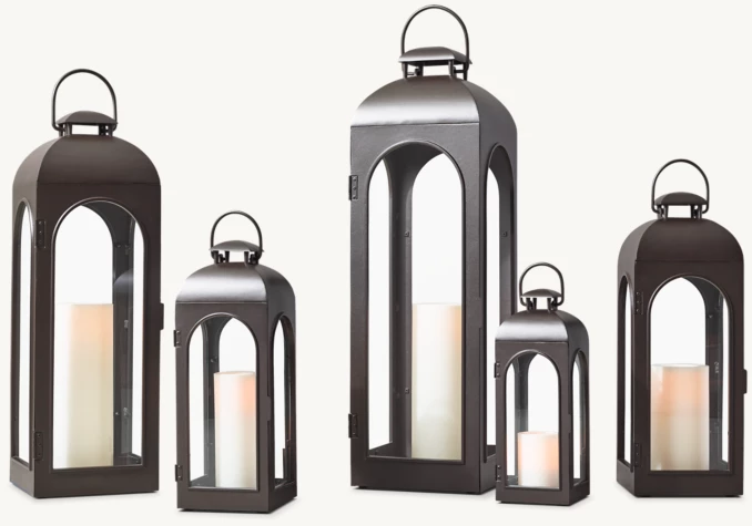 Elegant black lanterns with candles for ambient lighting.
