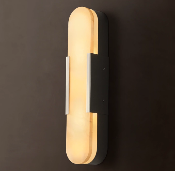 Modern alabaster sconce with brass accents for elegant lighting.