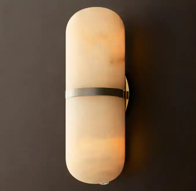 Modern alabaster sconce with a sleek black band for ambient lighting.