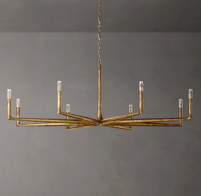 Modern brass chandelier with multiple candle-style lights for elegant lighting.