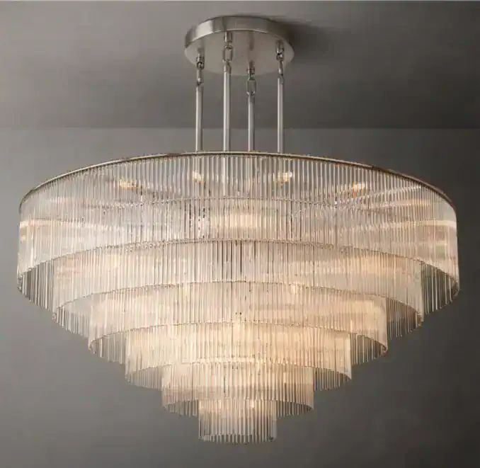 Elegant crystal chandelier with multiple tiers of glass rods for luxury lighting.