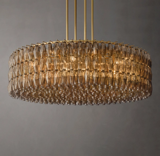Elegant round glass chandelier with gold accents for modern interiors.