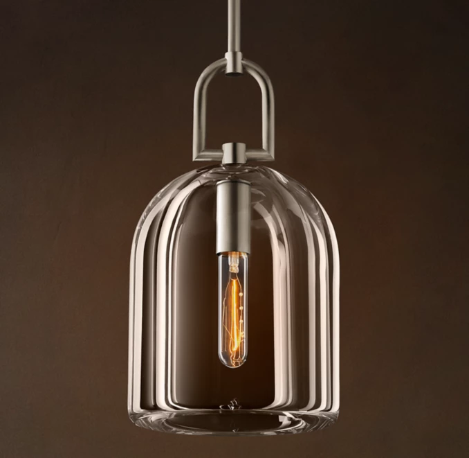 Gorvey Lighting glass cloche pendant with vintage filament bulb.