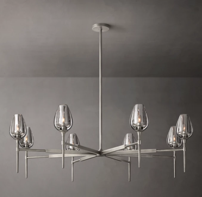 Modern crystal chandelier with glass shades and sleek metal frame.