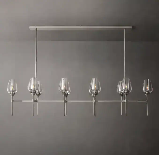 Modern linear chandelier with tulip-shaped crystal glass shades in solid brass.