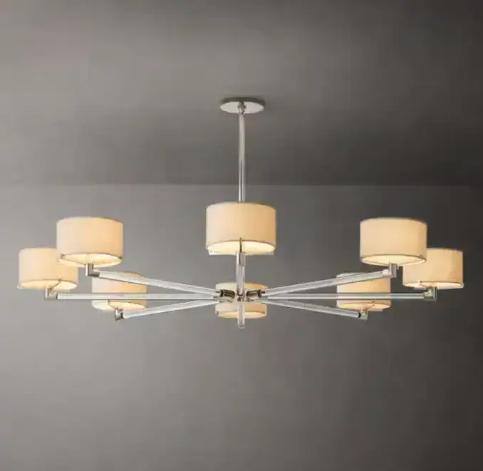 Modern round chandelier with crystal accents and beige lampshades for elegant lighting.
