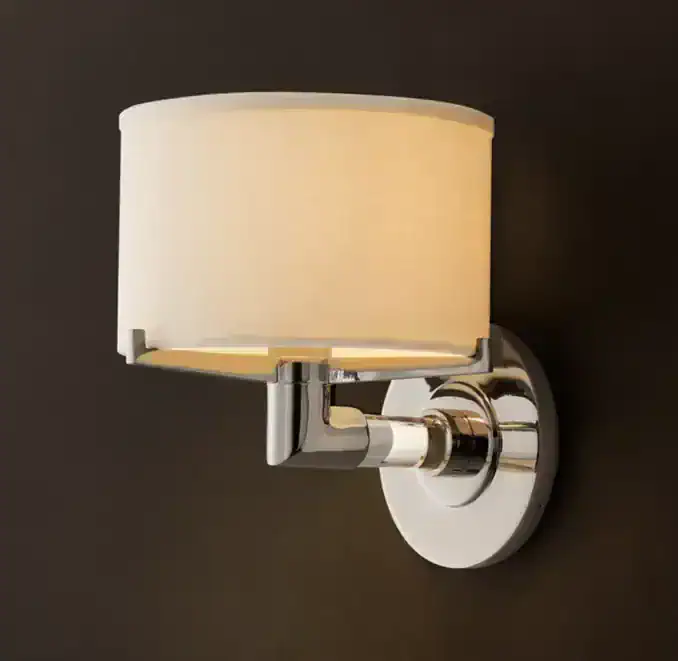 Elegant wall sconce with K9 glass and steel finish for modern lighting.