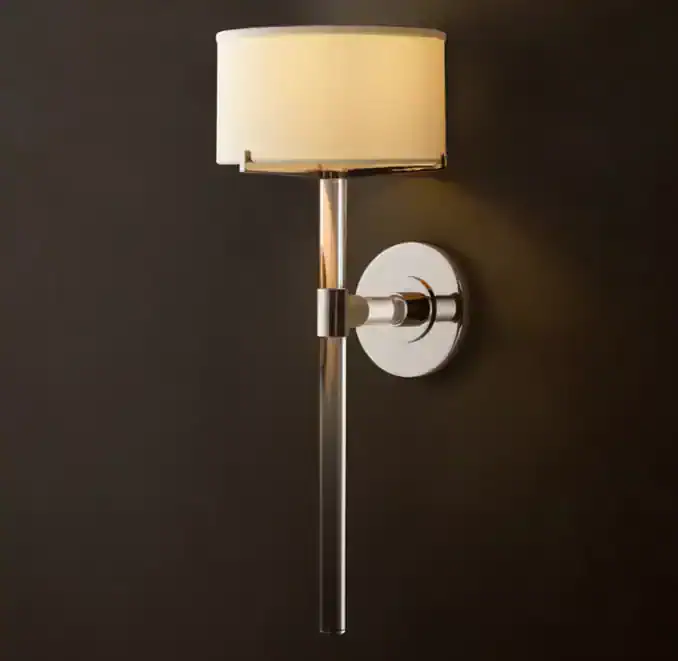 Elegant wall sconce with crystal accents and modern design for sophisticated lighting.