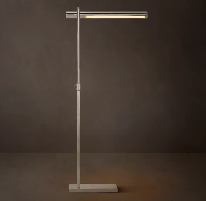 Modern adjustable floor lamp with sleek metal design for task lighting.