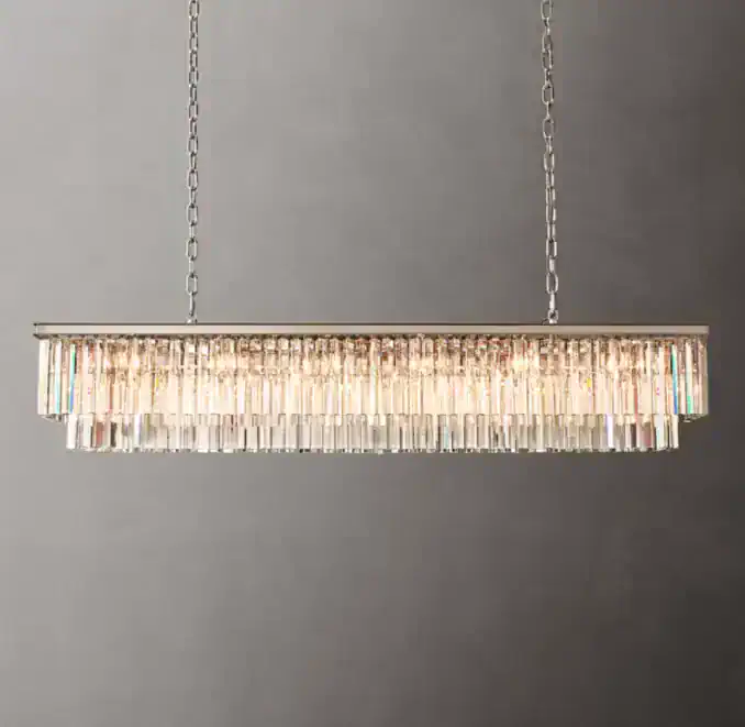 Elegant crystal chandelier hanging from silver chains for modern decor.