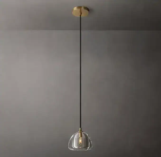Modern glass and brass pendant light from Gorvey Lighting.