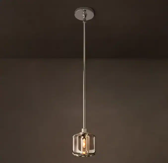 Modern pendant light with glass and metal design for stylish interiors.