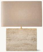Modern travertine table lamp with rectangular base and fabric shade.
