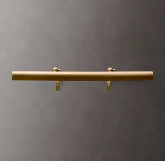 Minimalist lighting bar mounted on a gray wall for contemporary decor.