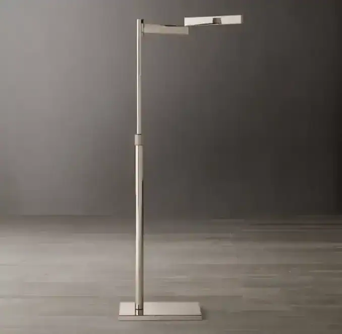 Modern brass task lamp with adjustable arm and sleek design.