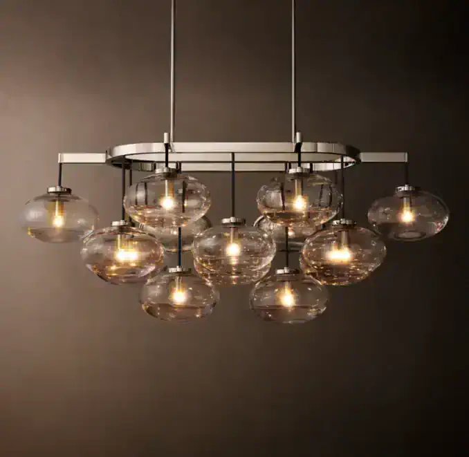 Modern glass chandelier with multiple glass globes and sleek metal frame.