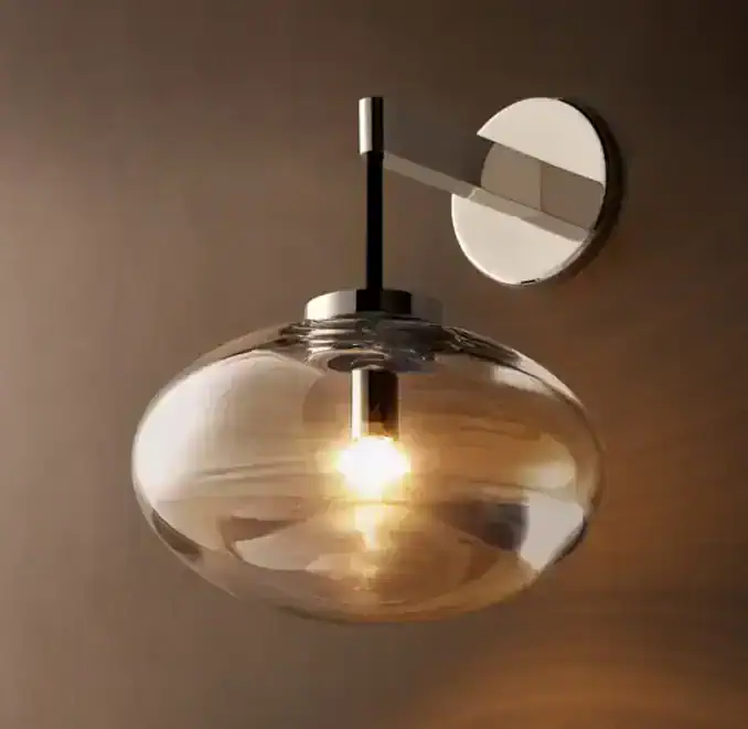 Modern glass steel wall sconce with warm lighting for interior decor.