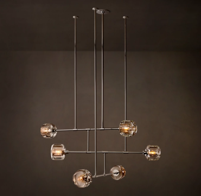 Contemporary glass chandelier with multiple glass globes and sleek metal design.