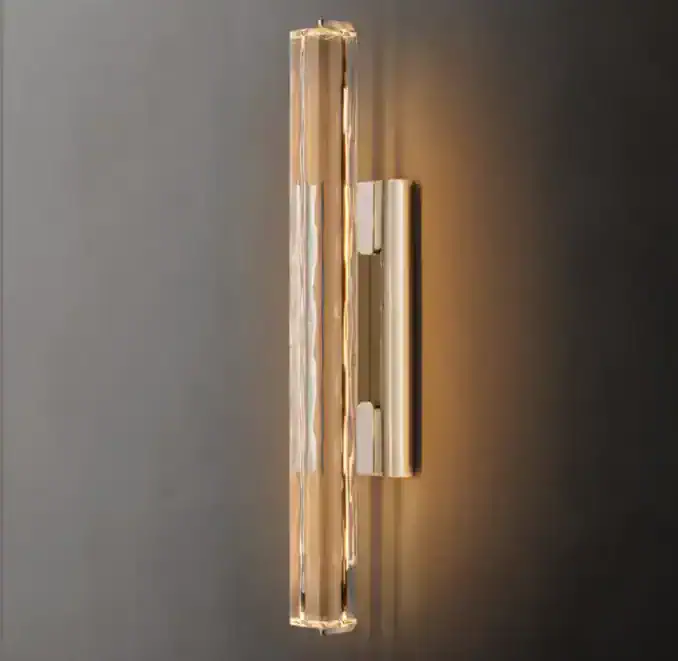 Elegant crystal brass sconce with modern design for wall lighting.
