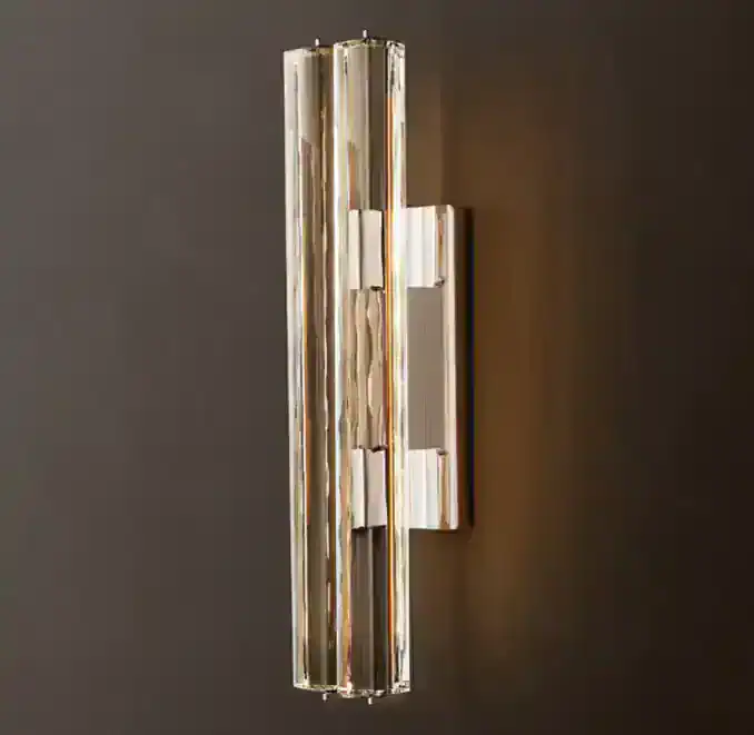 Gorvey brass crystal wall sconce with double wall light design.