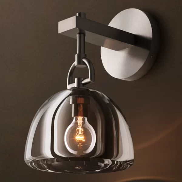Gorvey Lighting brass sconce with glass shade and exposed bulb for modern decor.