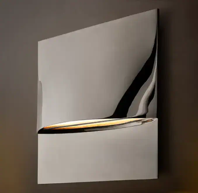 Contemporary wall sconce with sleek design and warm lighting.