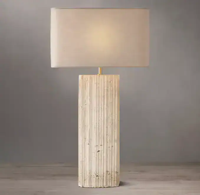 Elegant travertine lamp with rectangular shade for modern decor.