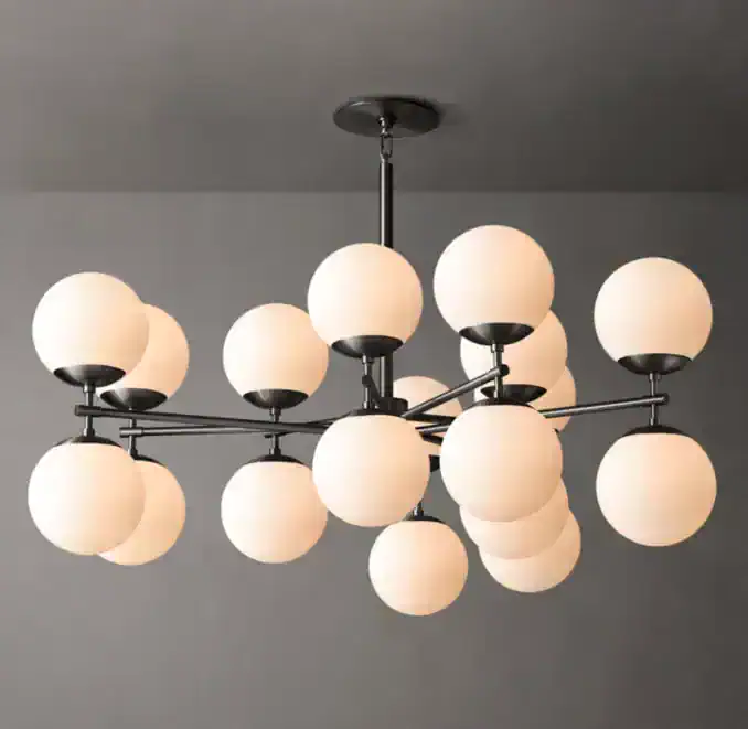 Modern chandelier with multiple spherical white glass shades and black metal frame.