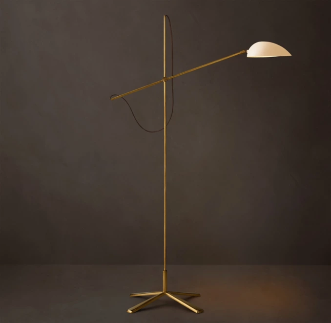 Modern steel floor lamp with adjustable arm and white shade for stylish lighting.