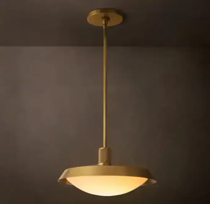 Brass pendant light with milk glass shade from Gorvey Lighting.