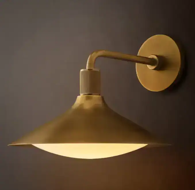 Gorvey wall sconce with brass finish and milk glass shade for elegant lighting.