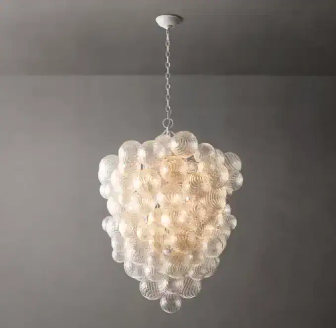 Elegant glass foyer chandelier with multiple glass orbs for modern lighting.
