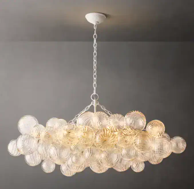 Elegant glass chandelier with multiple glass orbs for modern lighting.