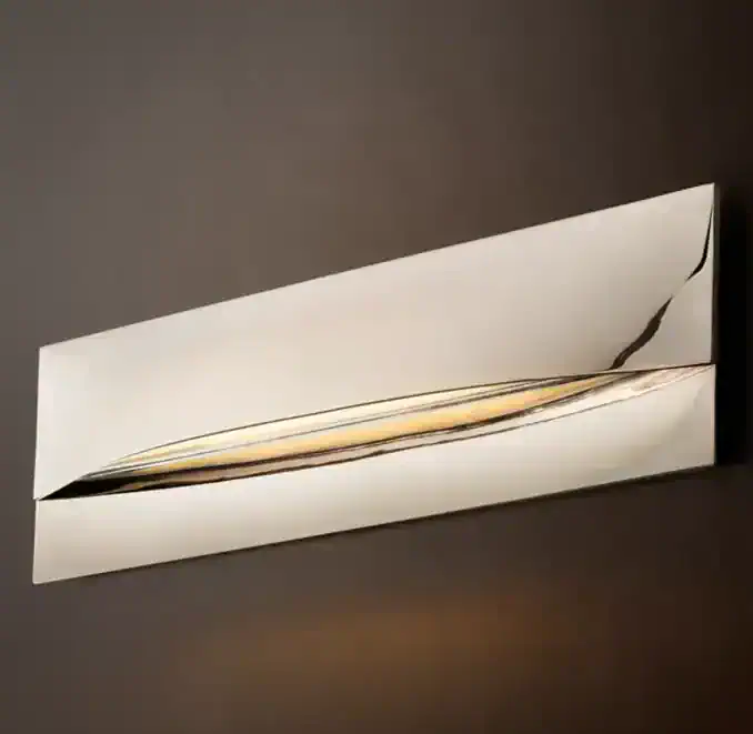Modern brass linear sconce with sleek design for contemporary lighting.