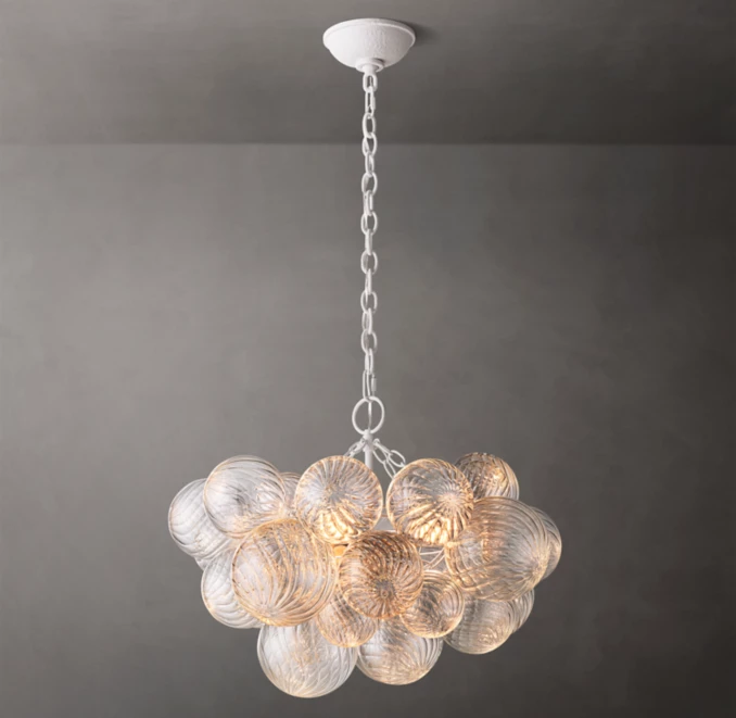 Elegant round glass chandelier with multiple glass globes and chain suspension.