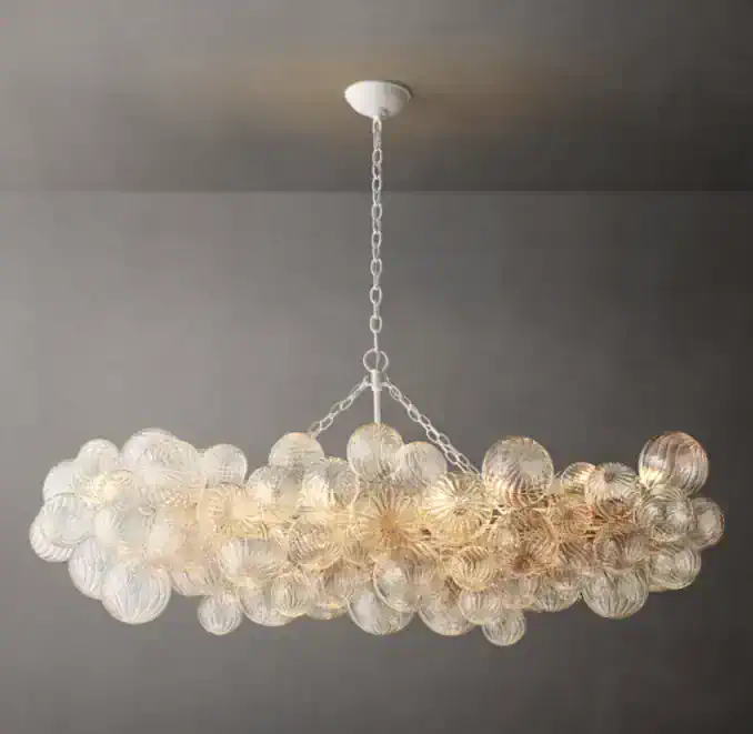 Elegant glass chandelier with multiple spherical glass shades for modern decor.