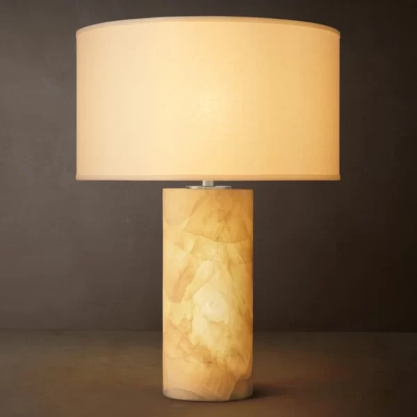 Gorvey Calcite Table Lamp with beige shade and cylindrical base.