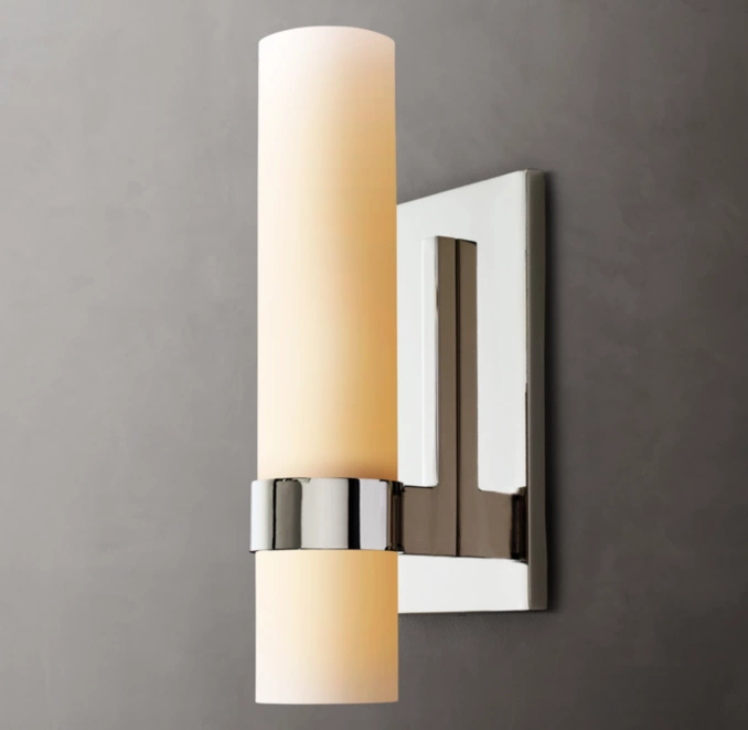 Modern wall sconce with milk glass shade and chrome finish for elegant lighting.