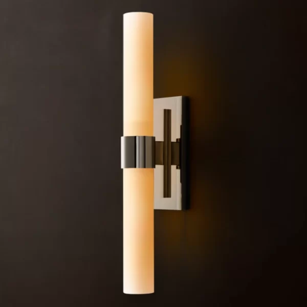 Modern wall sconce with cylindrical light and black metal mount.