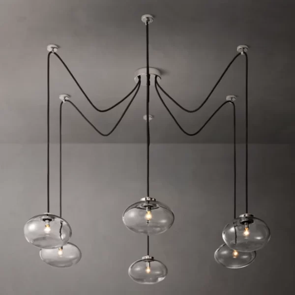 Modern glass chandelier with five hanging globes for elegant lighting.
