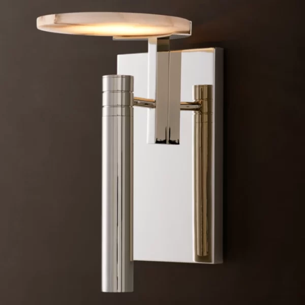 Modern wall light with disc-shaped LED and metallic finish for stylish interiors.