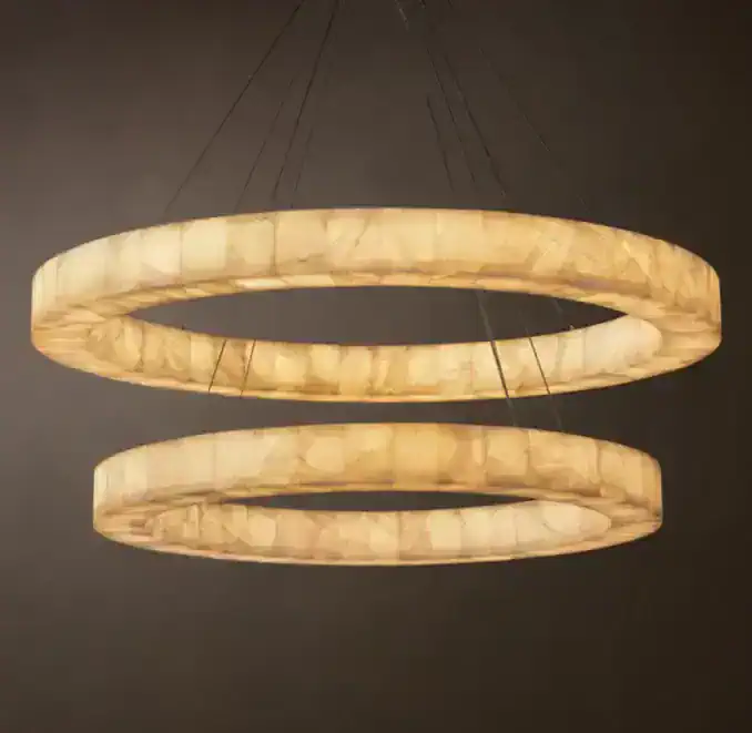 Elegant circular chandelier with warm glowing onyx-like rings for modern decor.