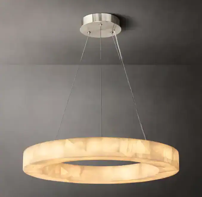 Modern circular chandelier with warm backlit on a gray ceiling.