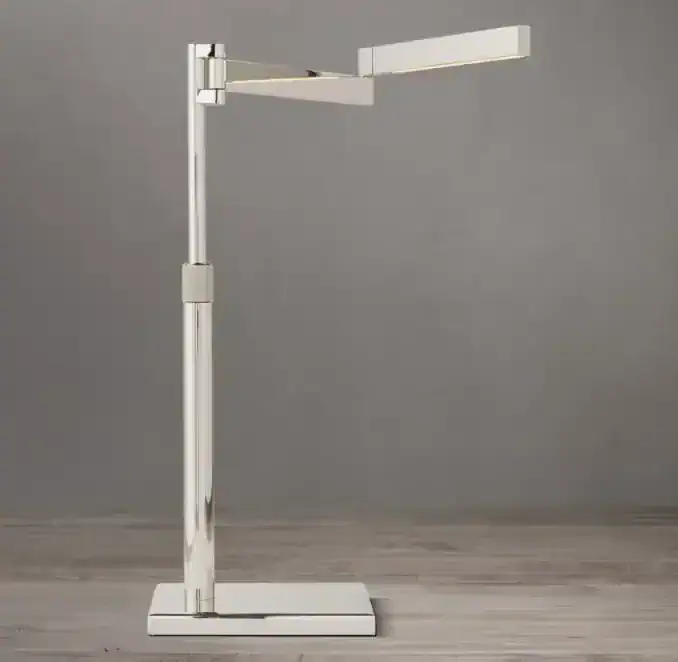 Modern white adjustable LED task lamp for workspace lighting.