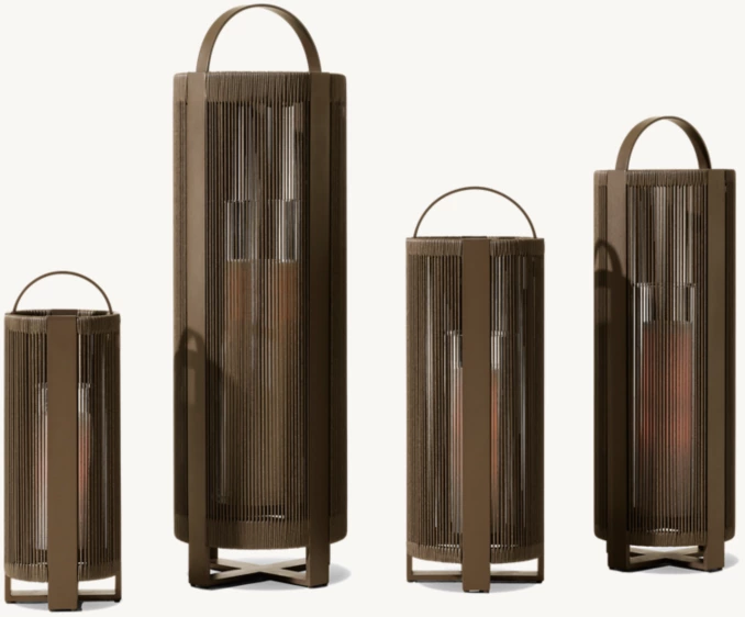 Set of four modern outdoor lanterns with vertical slats for ambient lighting.