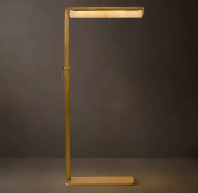Modern floor lamp with brass frame and LED light bar for stylish lighting.